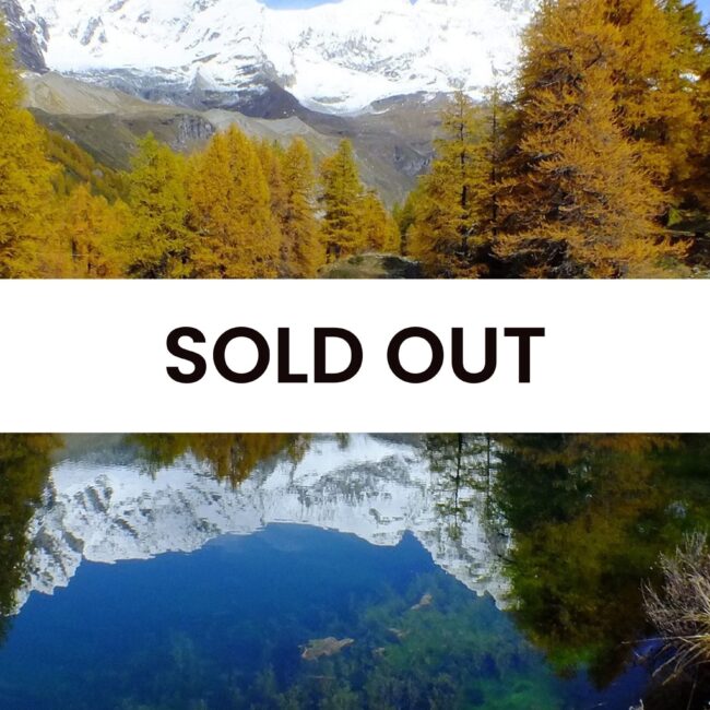 Immagine montagna e lago con scritta sold out